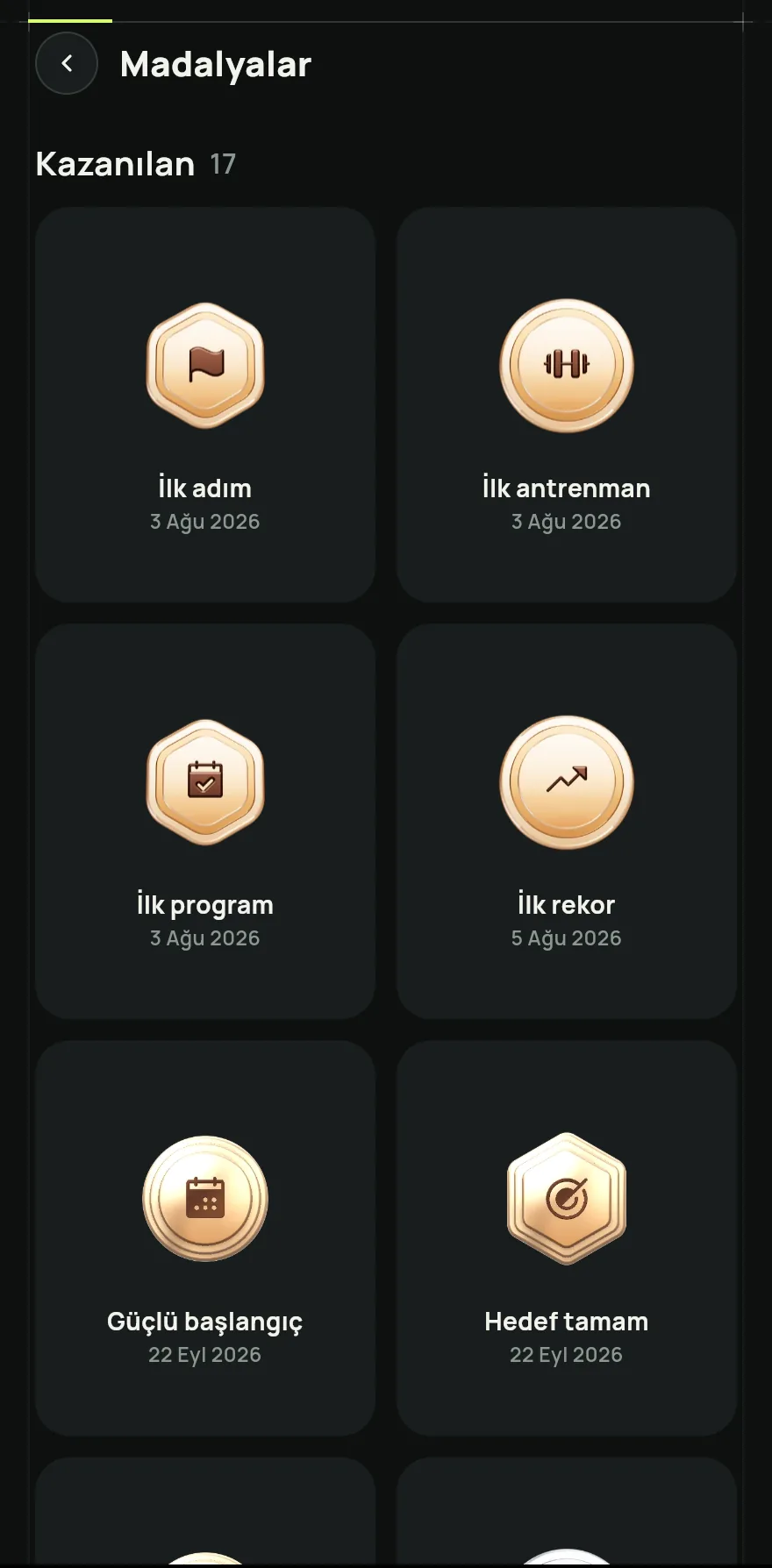 Profil sekmesini aç ve Antrenmanım ve ilerlemem altında Madalyalar öğesine dokun.